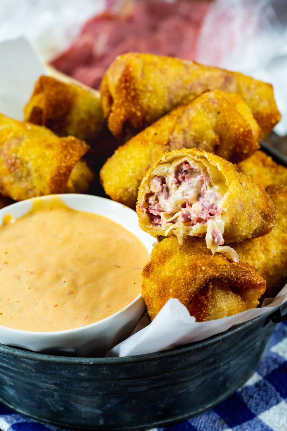 Reuben Egg Roll cut in half to show inside.