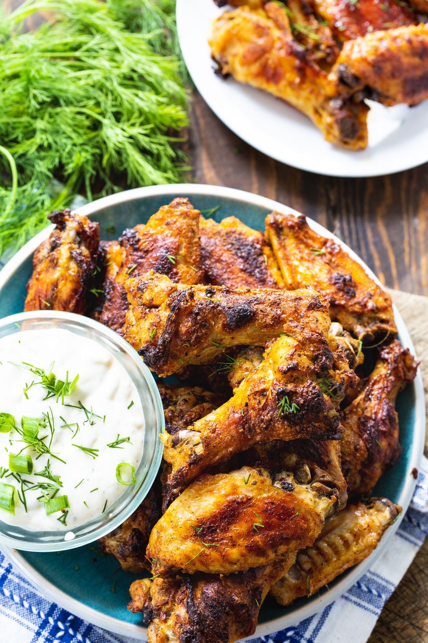 Ranch Wings on a plate with bowl of Ranch dressing.