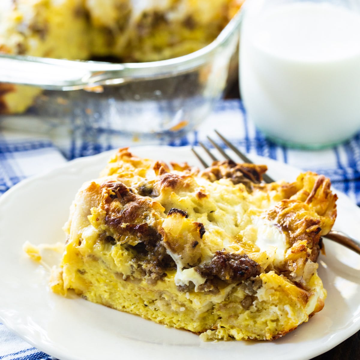 Slice of Sausage and Cheese English Muffin Breakfast Casserole on a plate.