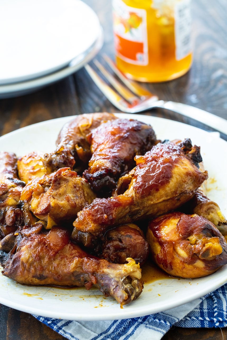 Garlic Peach Chicken Legs on a plate.