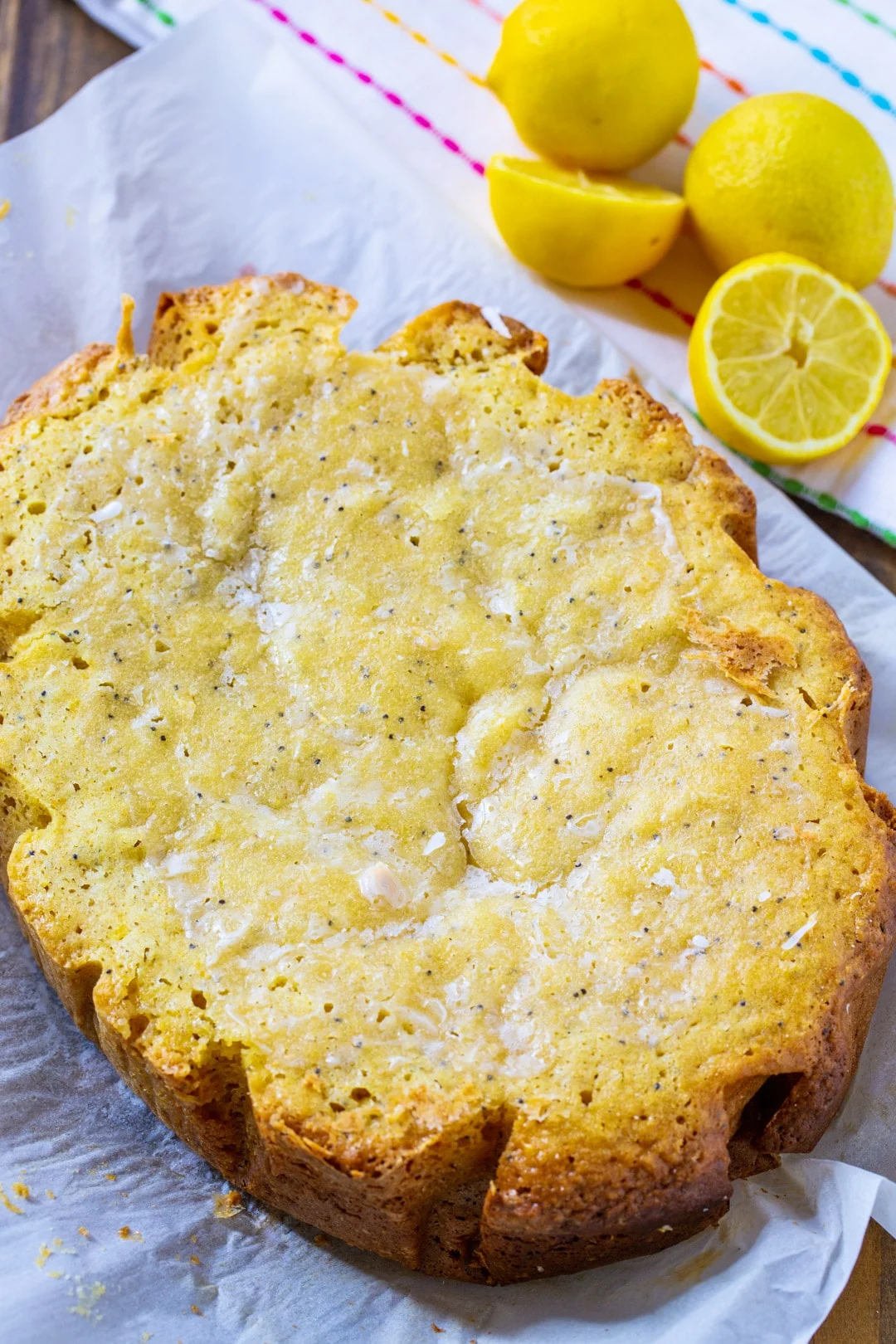 Whole Slow Cooker Lemon Cake and fresh lemons.
