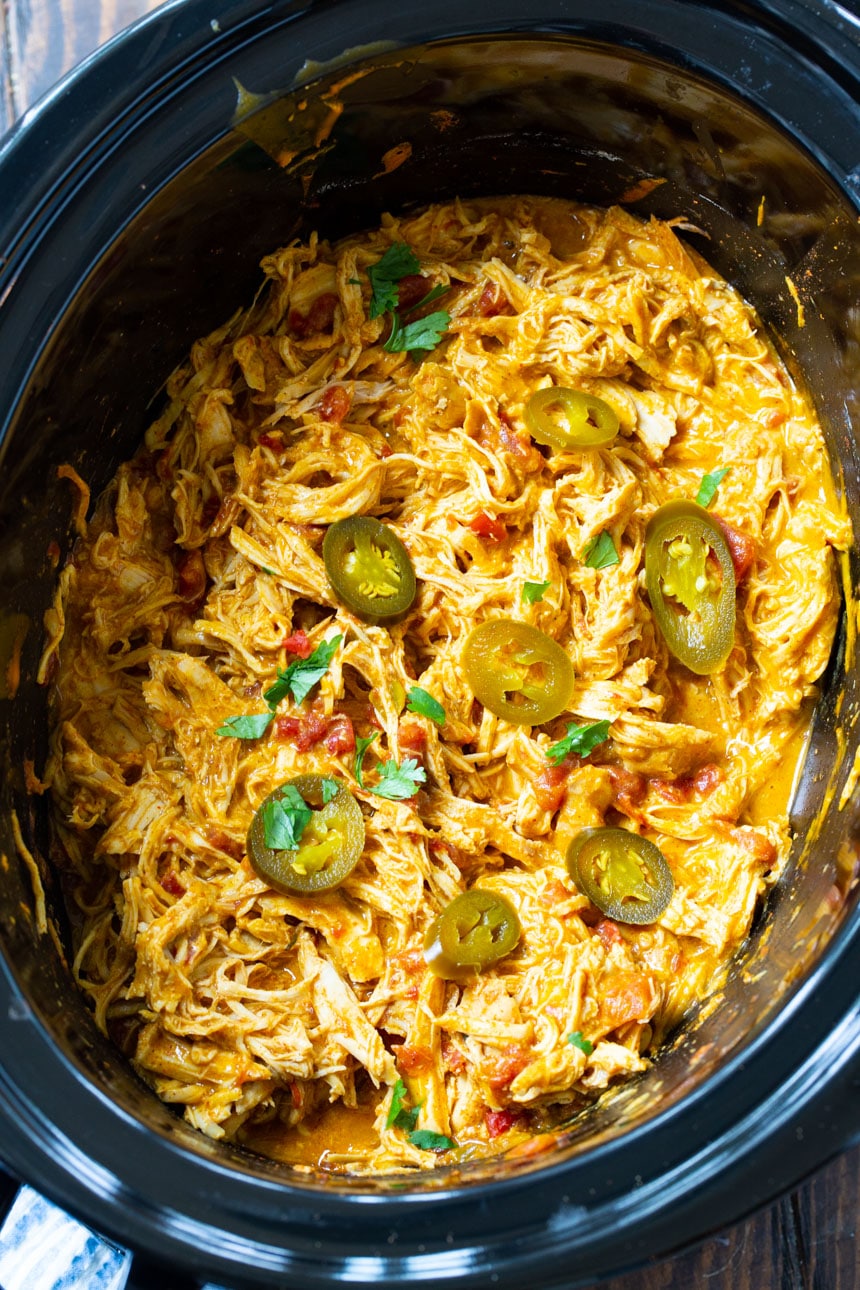 Shredded NAcho Chicken in a black 6-quart slow cooker