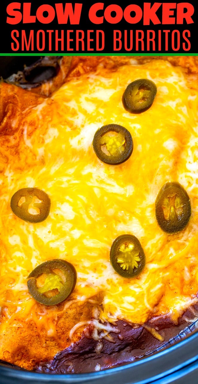 Smothered Burritos covered in cheese in a slow cooker