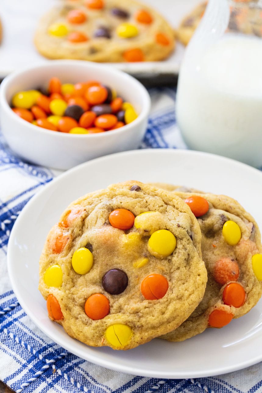 Soft Baked Reese's Pieces Cookies on a small white plate.