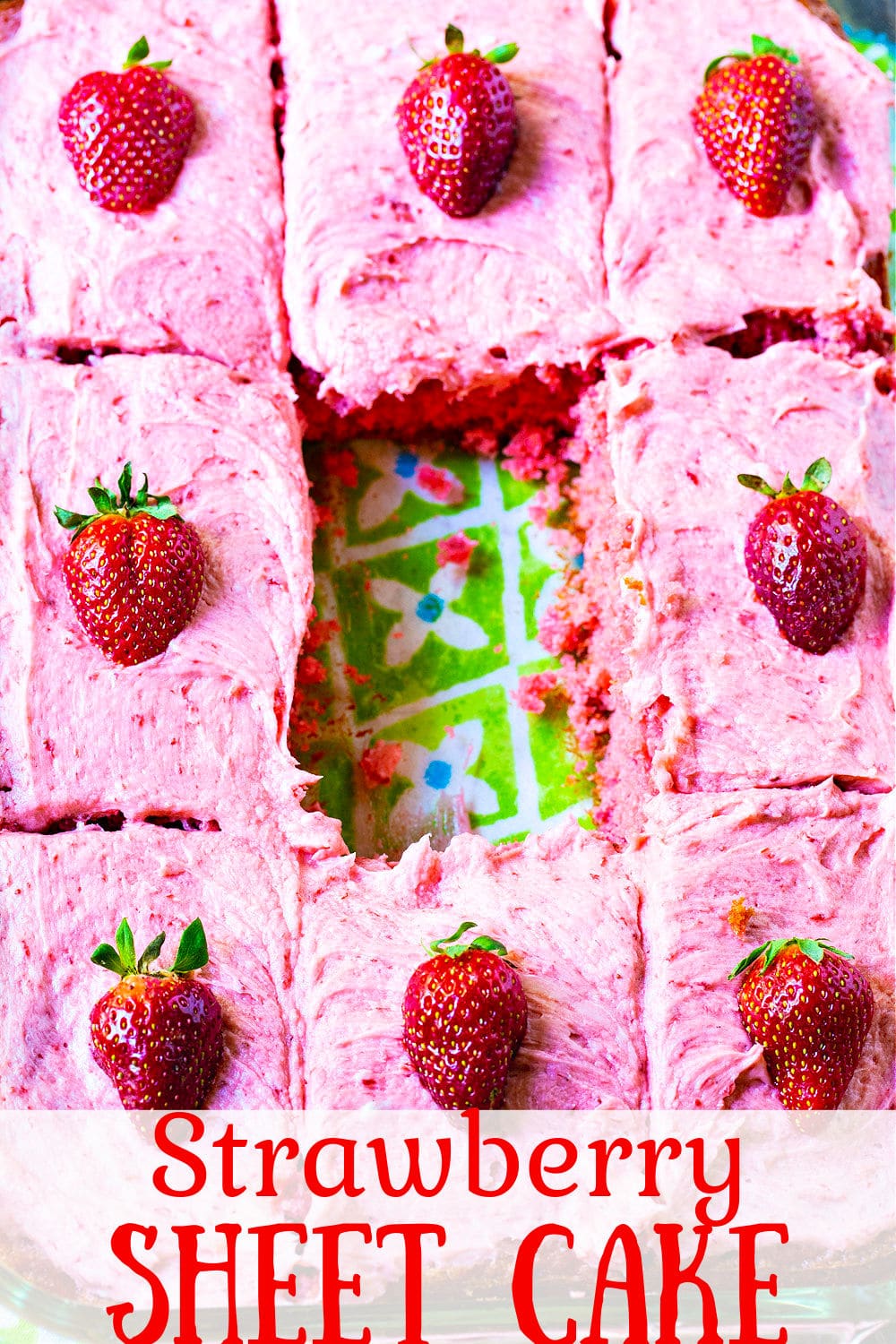 Strawberry Sheet Cake with one piecce taken out of the middle.