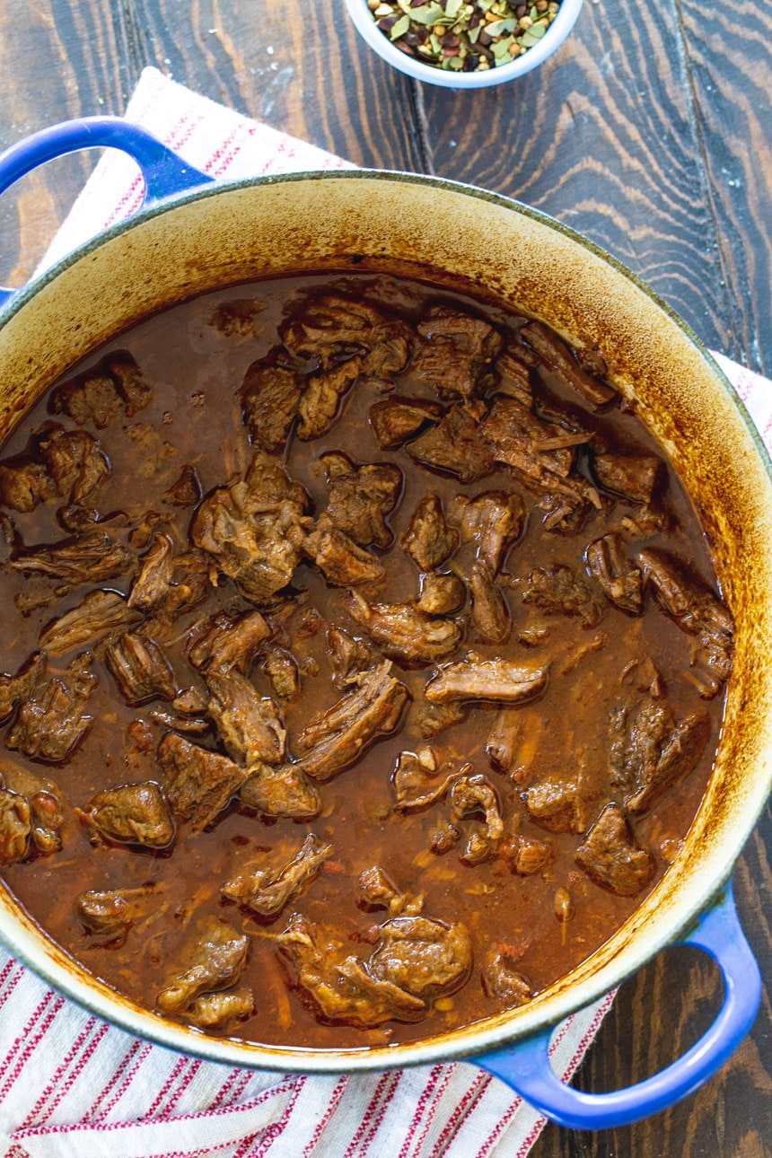 Sweet and Tangy BBQ Beef in blue Dutch oven.
