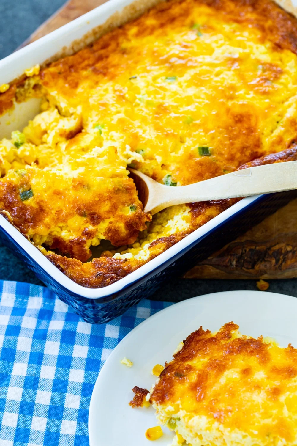 Spoon scooping up Three Cheese Corn Pudding
