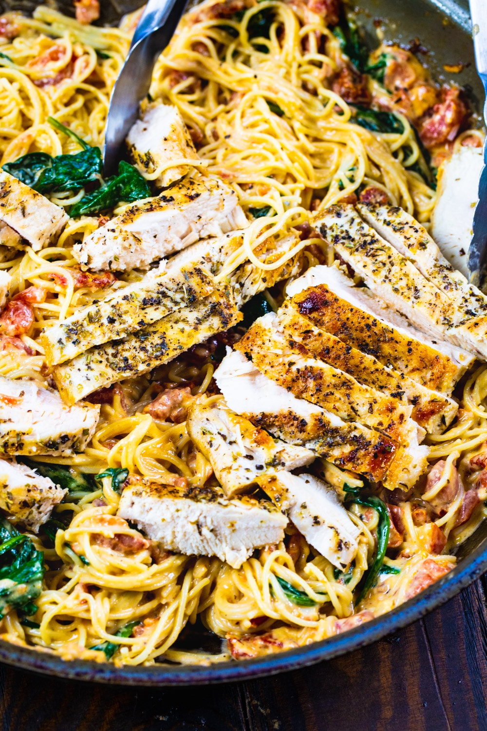 Tuscan-Style Pasta with chicken in a large skillet.