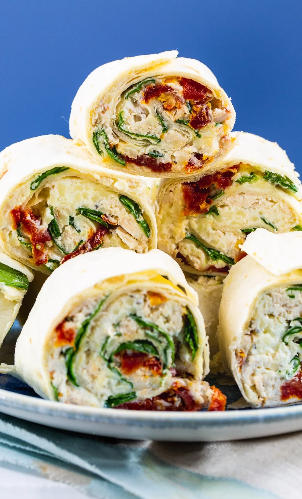 Pinwheels piled up on a plate.