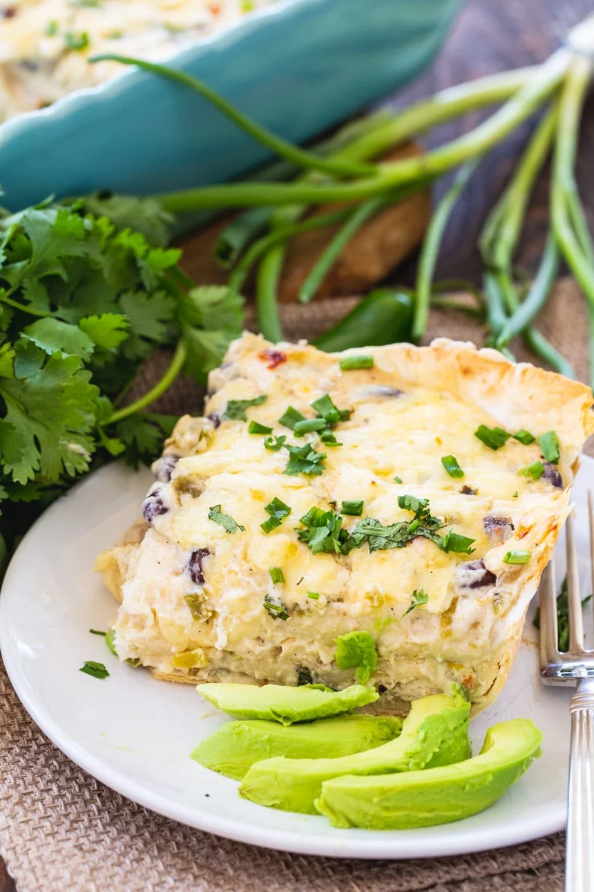 White Chicken Enchilada Casserole with sliced avocado
