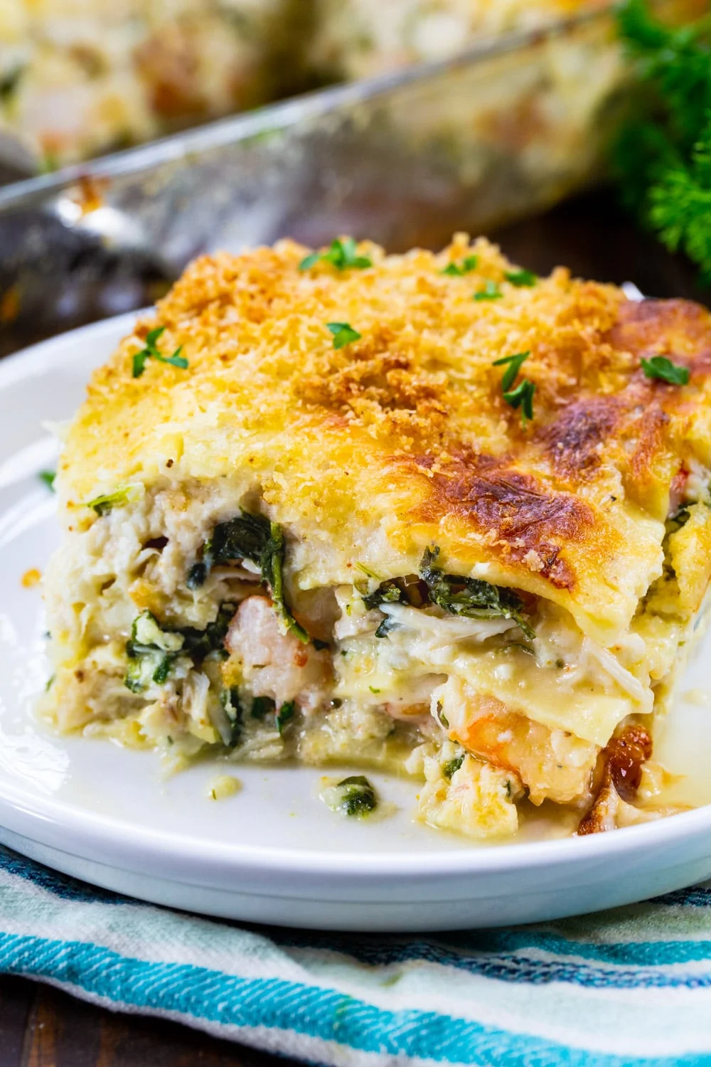 Slice of White Seafood Lasagna on a plate.