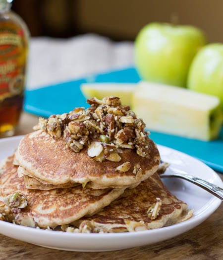Whole Wheat Pancakes with Nutty Topping on a white plate.