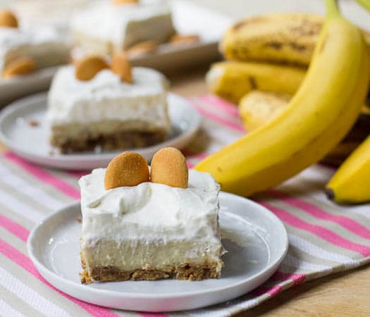 Banana Pudding Bars cut into squares and topped with vanilla wafers.