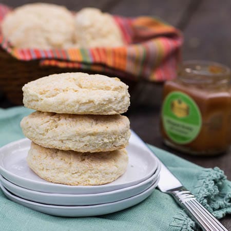 Flying Biscuit Cafe Biscuits on a plate with more biscuits in background.