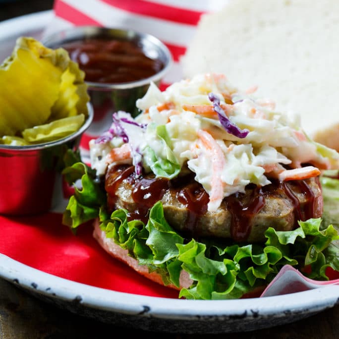 Southern BBQ Pork Burgers with creamy coleslaw and BBQ sauce.