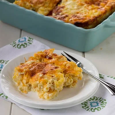 Slice of Baked Mac and Cheese on a plate with a fork.