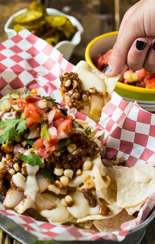Vegetarian BBQ Nachos made with meatless crumbles and a quick and easy queso sauce.