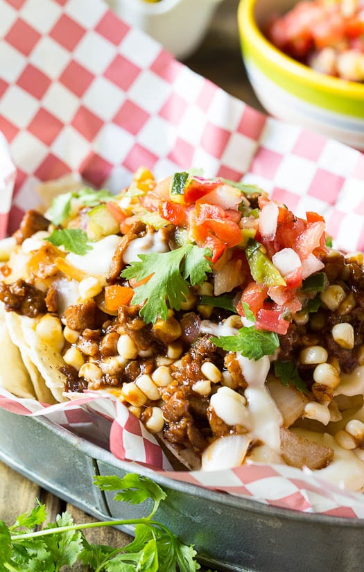 Vegetarian BBQ Nachos made with meatless crumbles and a quick and easy queso sauce.