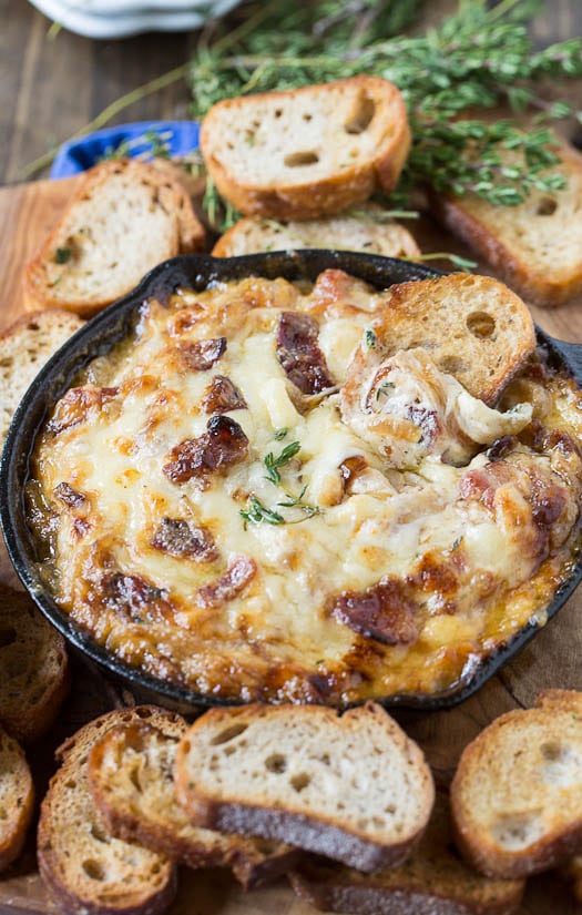 Hot Caramelized Onion Dip with Bacon and Gruyere and baguette slices.