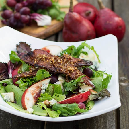 Apple-Pear Salad with Maple-Pecan Bacon in a white bowl.