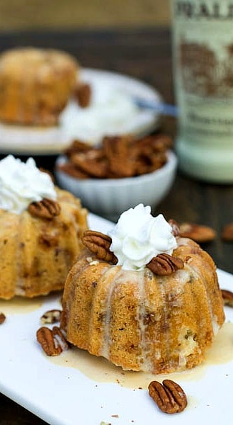 Mini Bundt Cakes topped with whipped cream.