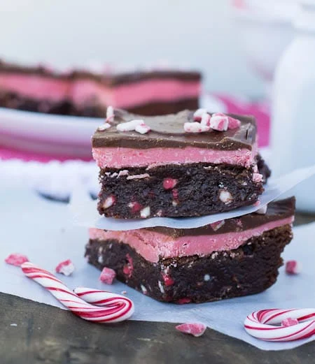 Two Brownies stacked with candy canes.