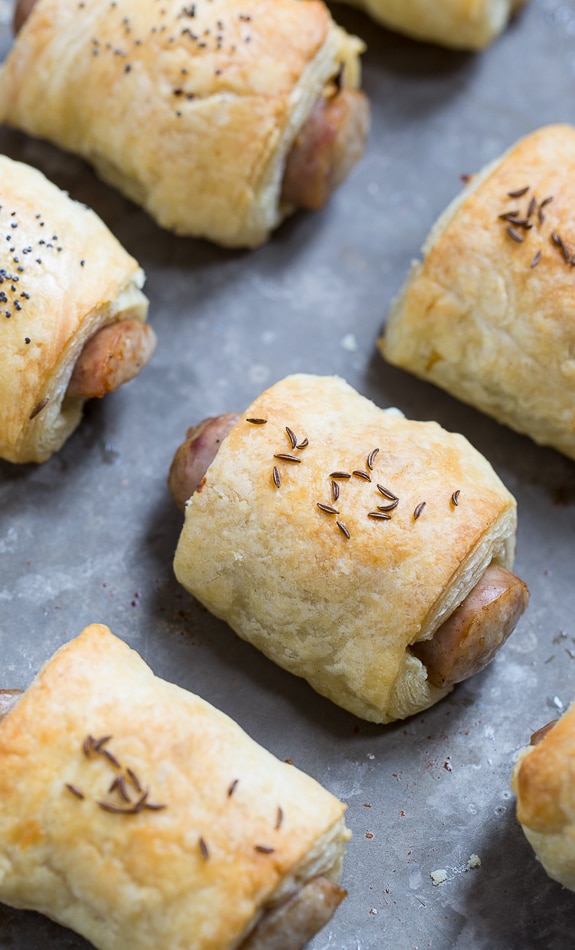 German-Style Pigs in a Blanket with bratwurst, mustard, and kraut.