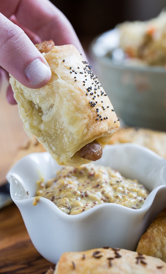 German-Style Pigs in a Blanket with bratwurst, kraut, and mustard.