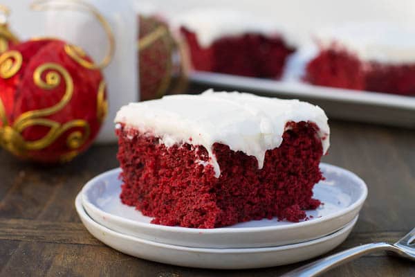 Slice of sheet cake on a white plate.