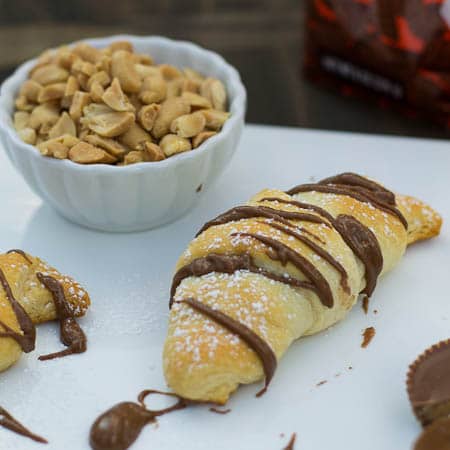 Reese's Crescent Roll with a bowl full of chopped peanuts.