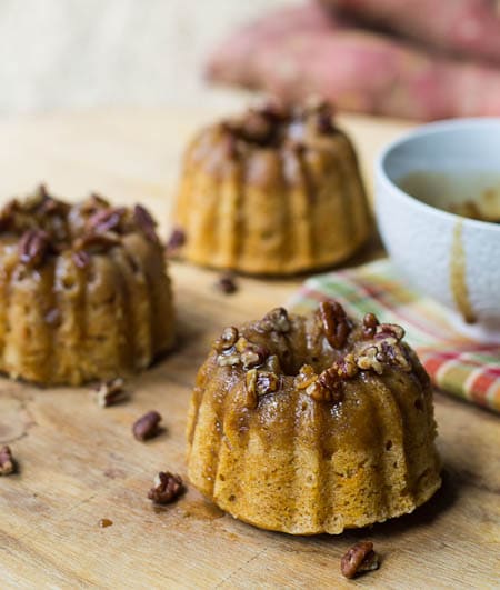 Individual Rum-Glazed Sweet Potato Cakes topped with pecans.