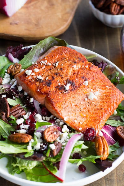 Seared Salmon with Mixed Greens over Dried Cranberries, Feta, and Candied Pecans