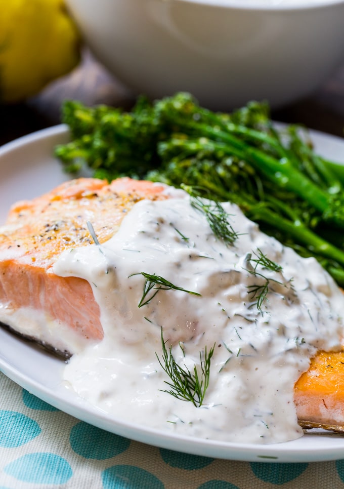 Baked salmon covered in a creamy dill sauce.