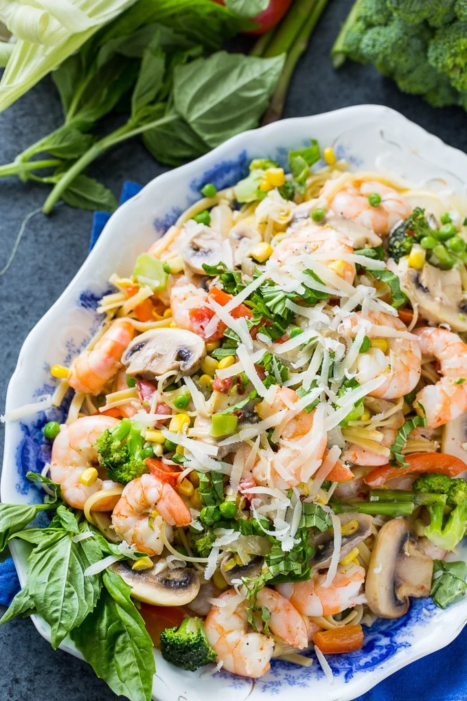 Shrimp Pasta Primavera with lots of fresh vegetables in a creamy sauce.