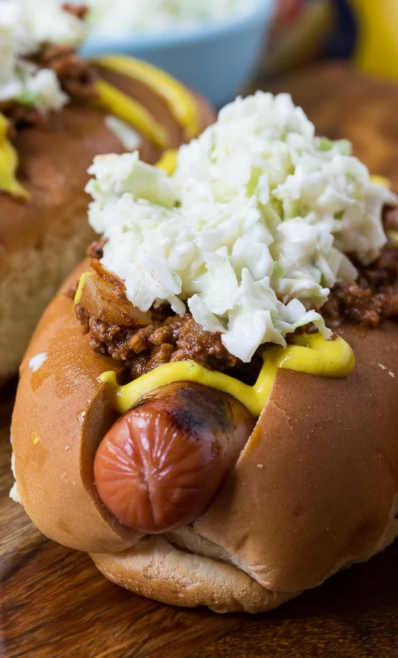 Carolina-Style Slaw Dogs with mustard and homemade chili.