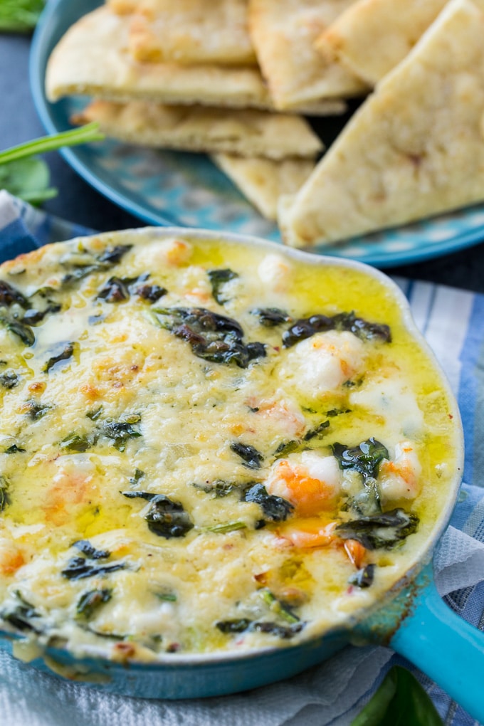 Cheesy Spinach and Shrimp Dip served with pita chips