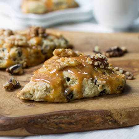 Turtle Scones topped with walnuts and caramel sauce.