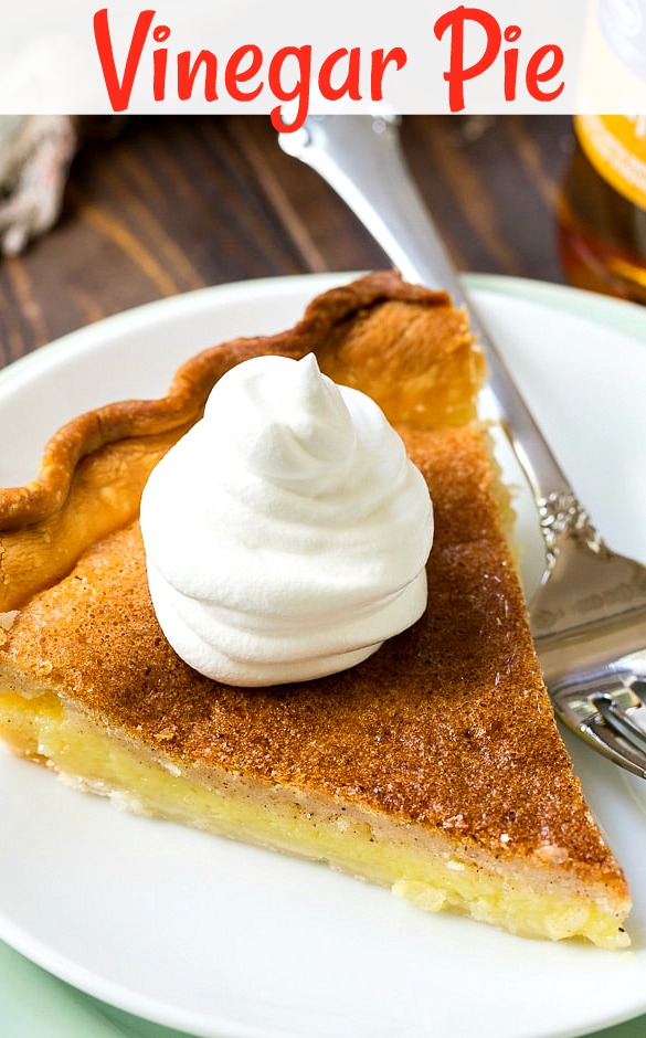 Slice of pie with whipped cream on top.