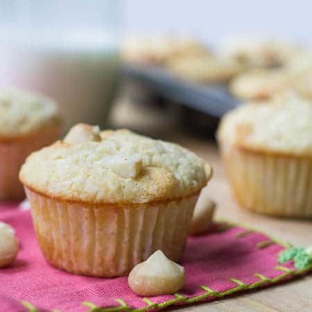 White Chocolate Macadamia Nut Muffins on pink napkin.